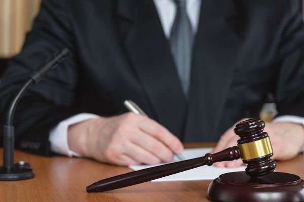 Lawyer And Court. Judge Hits The Table With Hammer. In The Court
